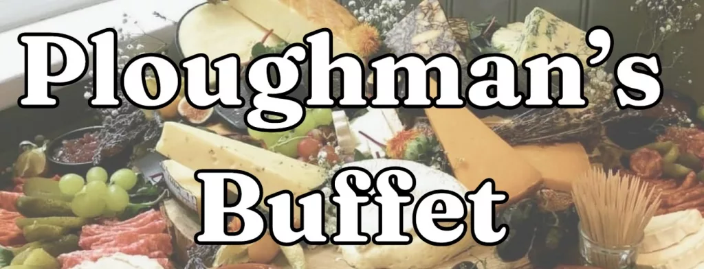 A visually rich spread showcasing a traditional Ploughman's Buffet. The image features an inviting assortment of classic British buffet items. In the foreground, various types of cheeses, including blocks of hard yellow cheese and marbled blue cheese, are arranged with care. Surrounding the cheese are fresh green grapes, slices of cured meats, pickles, and cherry tomatoes, creating a vibrant mix of textures and colors. Small dishes containing chutneys or jams are interspersed among the items, adding depth and variety to the display. Fresh herbs and delicate white flowers are thoughtfully scattered around, enhancing the rustic, artisanal appeal of the spread. In the bottom right, a container holds wooden skewers for easy serving. Large, bold text in a classic serif font reads 'Ploughman's Buffet,' prominently displayed over the center of the image. The background includes a hint of dark green wall paneling, adding a cozy, traditional British pub atmosphere to the presentation.